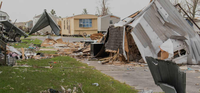 Severe hurricane damage to homes without storm shutters in Florida, destroyed buildings and debris